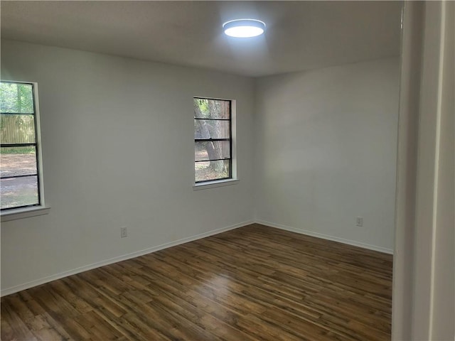 6290 Quail Ct, Theodore, AL 36582 - empty room featuring dark wood-type flooring and baseboards