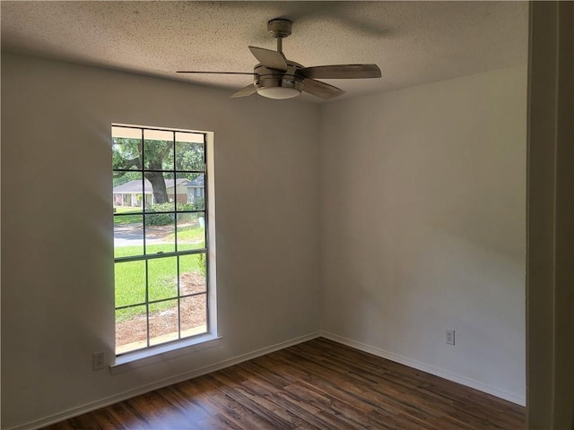 6290 Quail Ct, Theodore, AL 36582 - unfurnished room with dark wood-style flooring, baseboards, a ceiling fan, and a textured ceiling