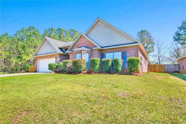 view of front facade featuring brick siding, an attached garage, a front yard, and fence