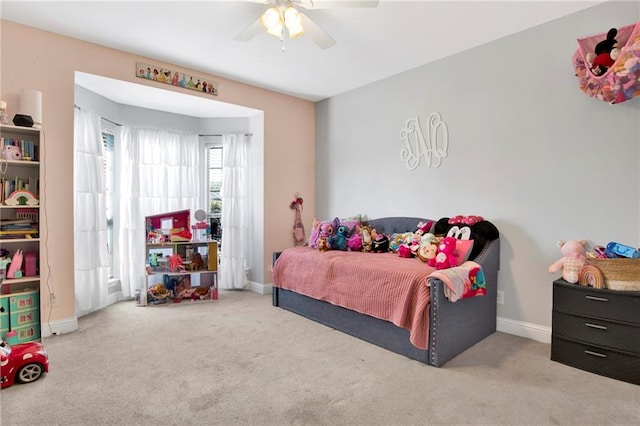 bedroom featuring baseboards, carpet floors, and ceiling fan