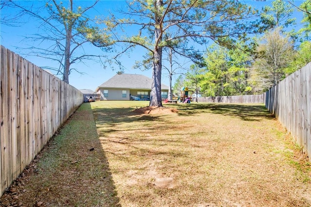 view of yard with a fenced backyard