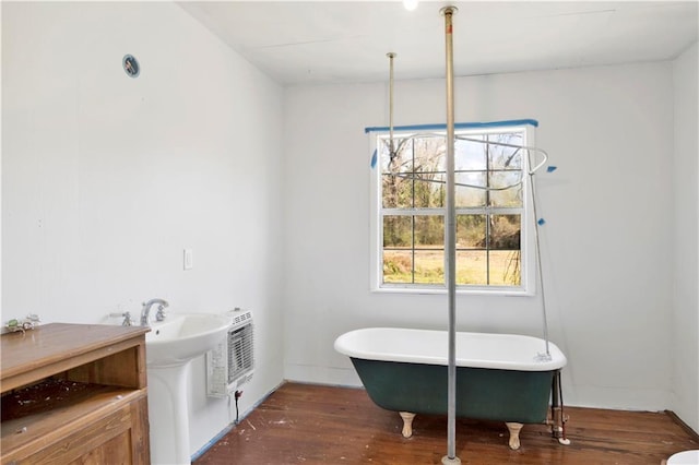 52780 State Highway 59, Stockton, AL 36579 - full bath featuring wood finished floors, a soaking tub, heating unit, and a sink