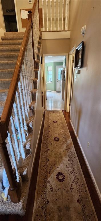 6325 Shadowlake Ct, Mobile, AL 36693 - hallway featuring stairway and a high ceiling