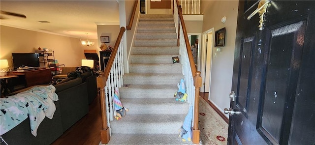 6325 Shadowlake Ct, Mobile, AL 36693 - stairs featuring crown molding, carpet, and a chandelier
