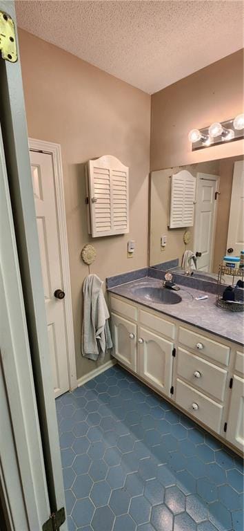 6325 Shadowlake Ct, Mobile, AL 36693 - bathroom with vanity, tile patterned flooring, and a textured ceiling