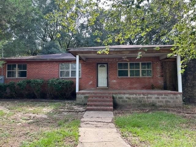 15131 Moffett Rd, Wilmer, AL 36587 - ranch-style house with brick siding and a porch