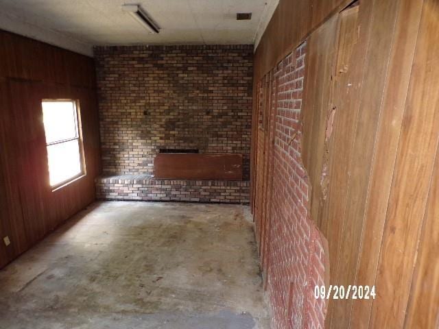 15131 Moffett Rd, Wilmer, AL 36587 - interior space with wood walls and unfinished concrete floors
