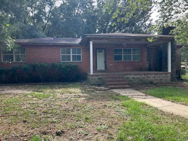 15131 Moffett Rd, Wilmer, AL 36587 - ranch-style home featuring brick siding, a front lawn, and covered porch