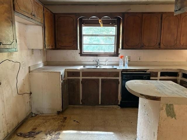 15131 Moffett Rd, Wilmer, AL 36587 - kitchen featuring light countertops, a sink, and black dishwasher