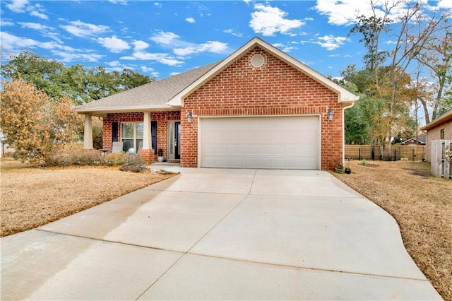 view of front of property featuring a garage and covered porch