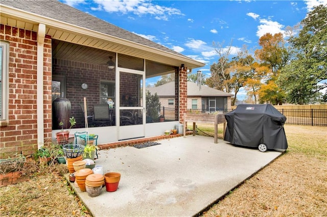 view of patio / terrace featuring a sunroom and area for grilling