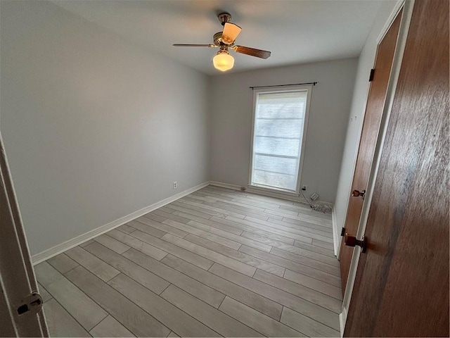 unfurnished room featuring light hardwood / wood-style flooring and ceiling fan