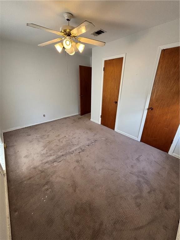 unfurnished bedroom with carpet flooring and ceiling fan