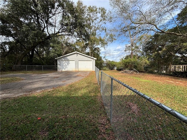 view of yard featuring an outbuilding and a garage