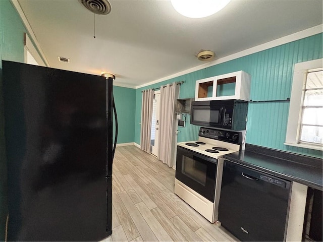 kitchen featuring black appliances, light wood-type flooring, and ornamental molding