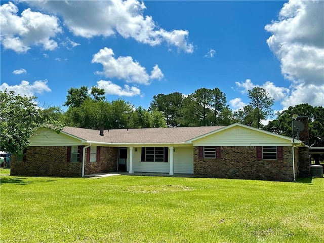 ranch-style home with a front lawn