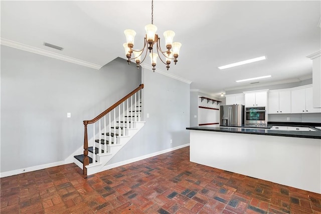 104 Ferncliff Cir, Daphne, AL 36526 - kitchen with stainless steel appliances, brick floors, crown molding, dark countertops, and white cabinets