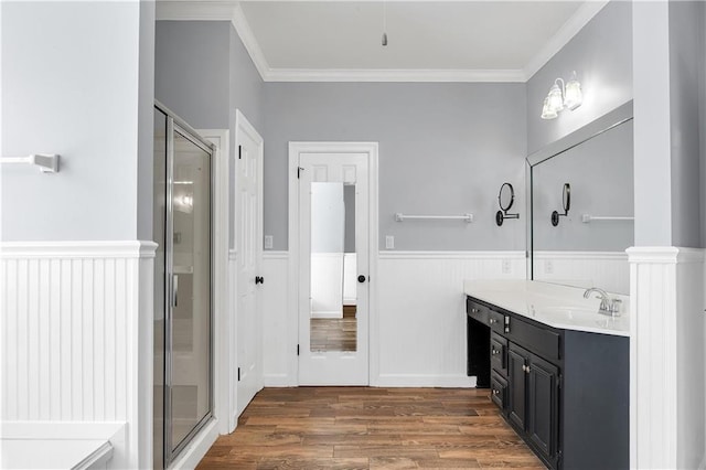 104 Ferncliff Cir, Daphne, AL 36526 - full bath featuring wood finished floors, a wainscoted wall, vanity, crown molding, and a shower stall