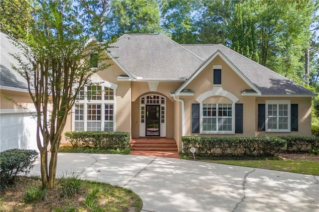 104 Ferncliff Cir, Daphne, AL 36526 - view of front of property with stucco siding, driveway, and roof with shingles