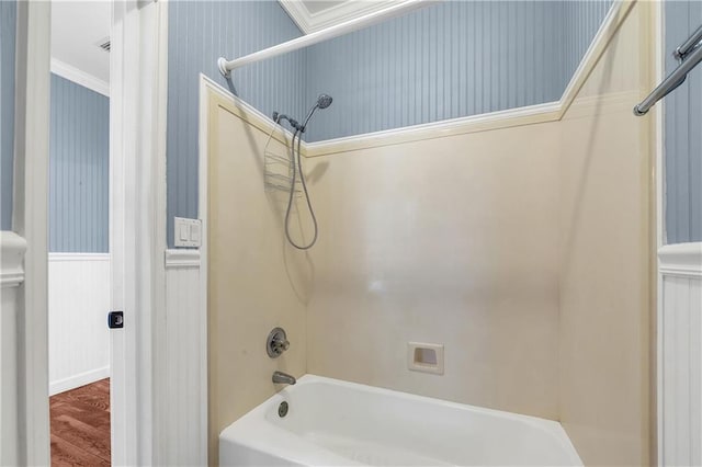 104 Ferncliff Cir, Daphne, AL 36526 - bathroom with bathtub / shower combination, ornamental molding, a wainscoted wall, wood finished floors, and wallpapered walls