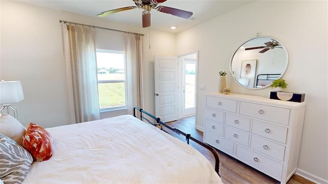 bedroom featuring hardwood / wood-style floors and ceiling fan