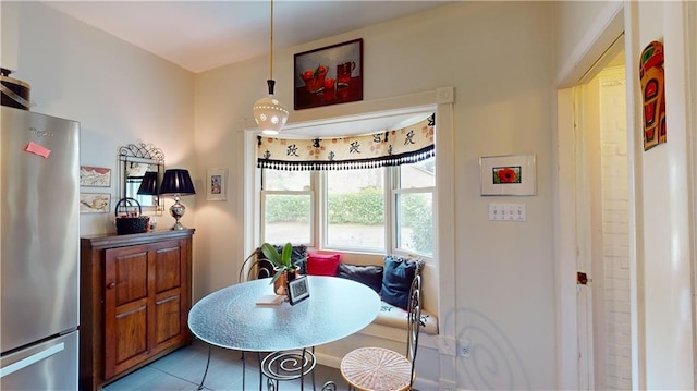 dining area with light tile patterned floors