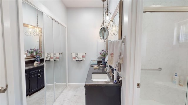 bathroom with a chandelier and vanity