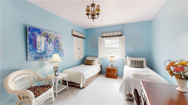 carpeted bedroom with a notable chandelier