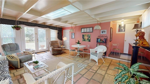 living room featuring beam ceiling and coffered ceiling