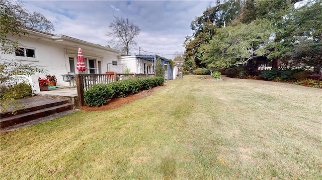 view of yard with a wooden deck