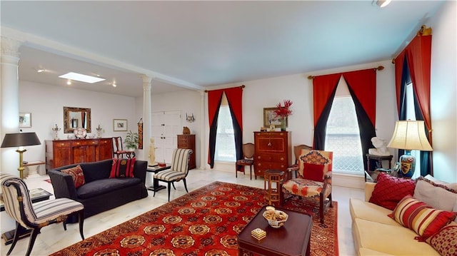 living room featuring decorative columns