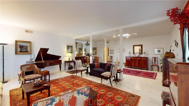 living room with ornate columns