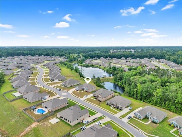 birds eye view of property with a water view and a residential view