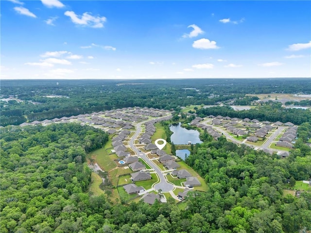birds eye view of property with a water view and a residential view