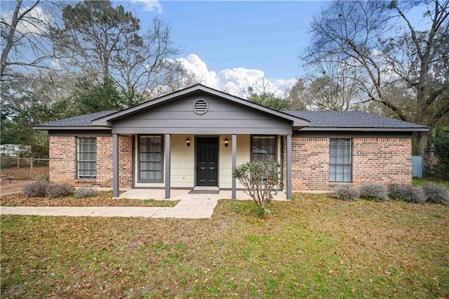 view of front of property with a porch and a front lawn