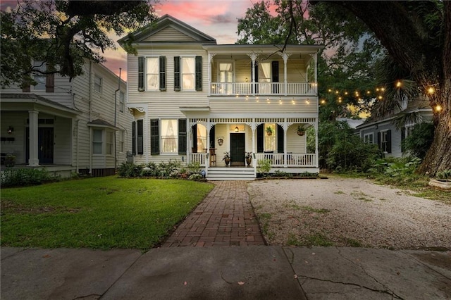 206 George St, Mobile, AL 36604 - view of front of home featuring a balcony, a porch, and a front lawn