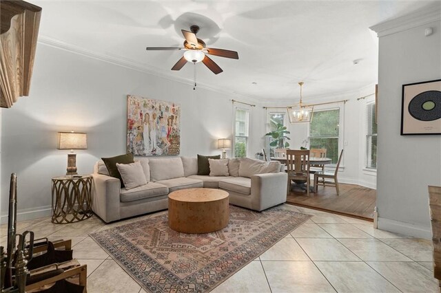 206 George St, Mobile, AL 36604 - living room featuring ceiling fan, baseboards, ornamental molding, and light tile patterned flooring