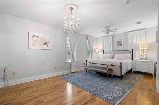 206 George St, Mobile, AL 36604 - bedroom featuring a chandelier, wood-type flooring, baseboards, and ceiling fan