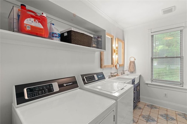 206 George St, Mobile, AL 36604 - washroom featuring washer and clothes dryer, cabinet space, healthy amount of natural light, ornamental molding, and baseboards