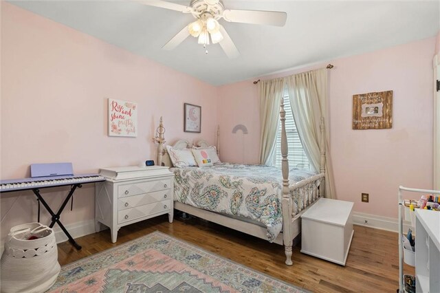 206 George St, Mobile, AL 36604 - bedroom with wood finished floors, baseboards, and a ceiling fan
