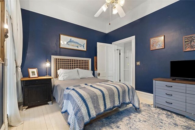206 George St, Mobile, AL 36604 - bedroom with wood finished floors, baseboards, and a ceiling fan