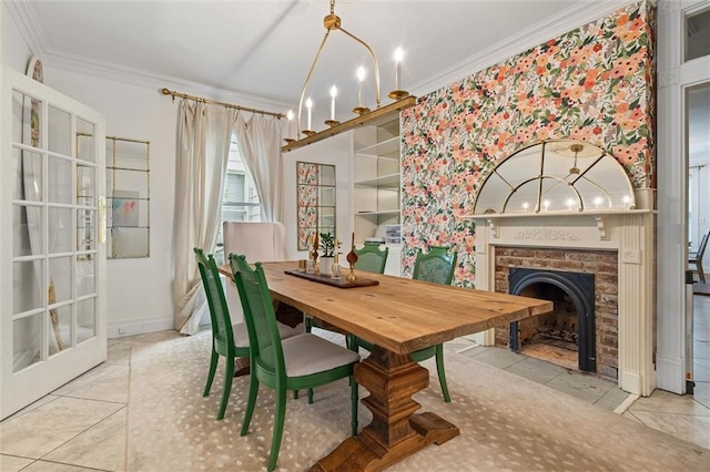 206 George St, Mobile, AL 36604 - dining area with ornamental molding, tile patterned floors, a fireplace, a chandelier, and baseboards