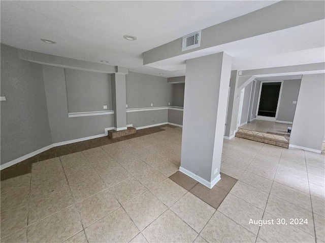 unfurnished room featuring tile patterned flooring