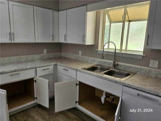 kitchen featuring sink and white cabinets