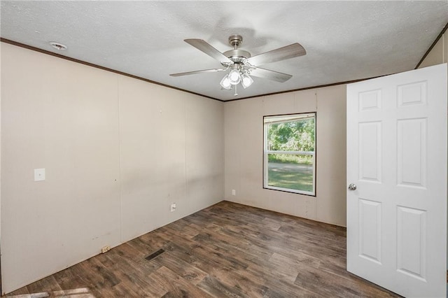 6550 Oak Grove Rd, Eight Mile, AL 36613 - unfurnished room featuring a ceiling fan, wood finished floors, a textured ceiling, and ornamental molding