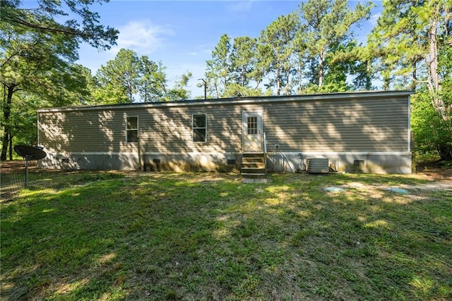 6550 Oak Grove Rd, Eight Mile, AL 36613 - back of property with entry steps, a lawn, and central AC