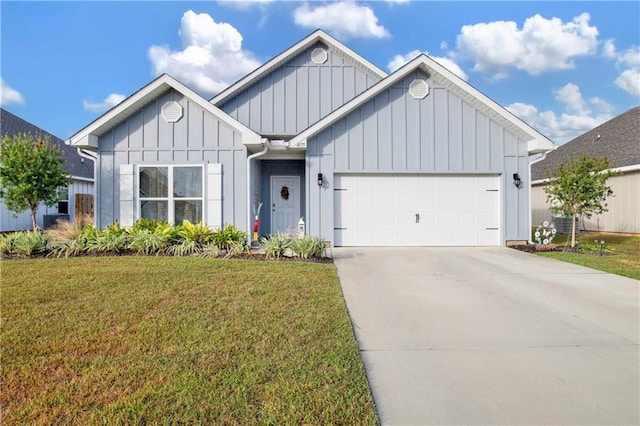 view of front of property with a garage and a front lawn