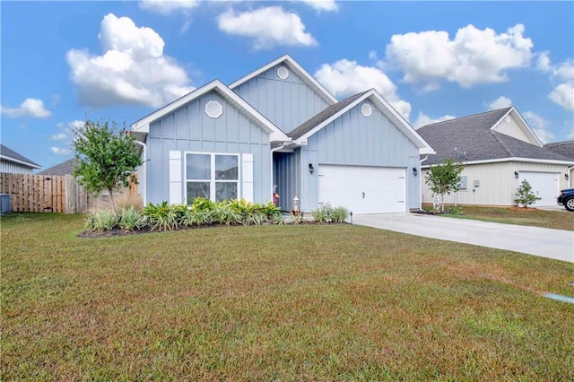 view of front of house with a front yard and a garage