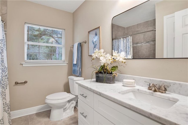 bathroom featuring toilet, tile patterned floors, walk in shower, and vanity