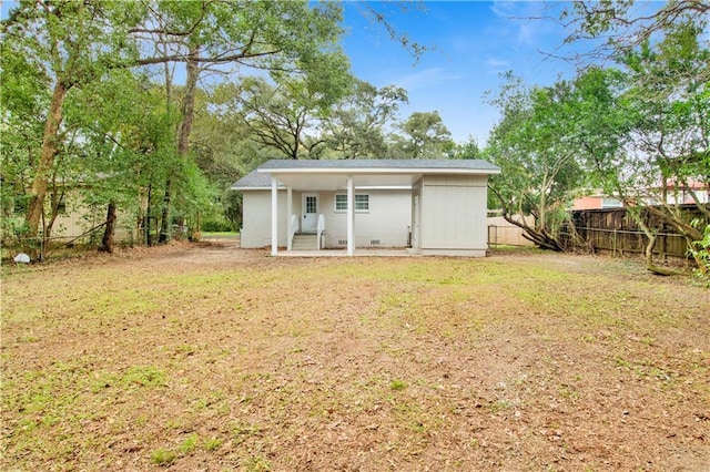 view of outdoor structure with a lawn